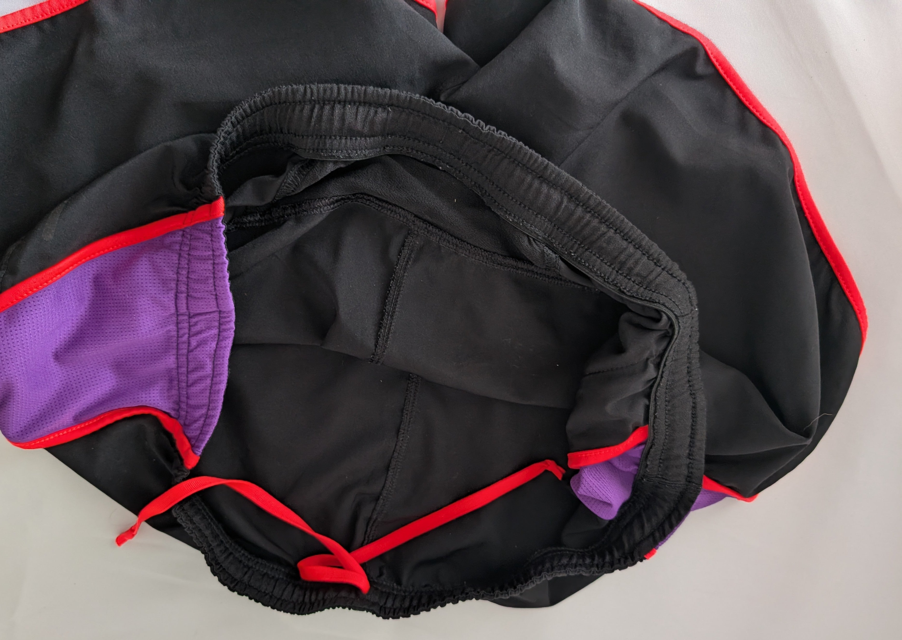 North Face Shorts, Black, bright pink and purple, Size M.